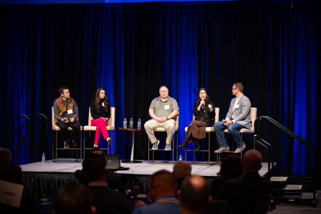 A group of people on stage at the Tech Nebraska Summit