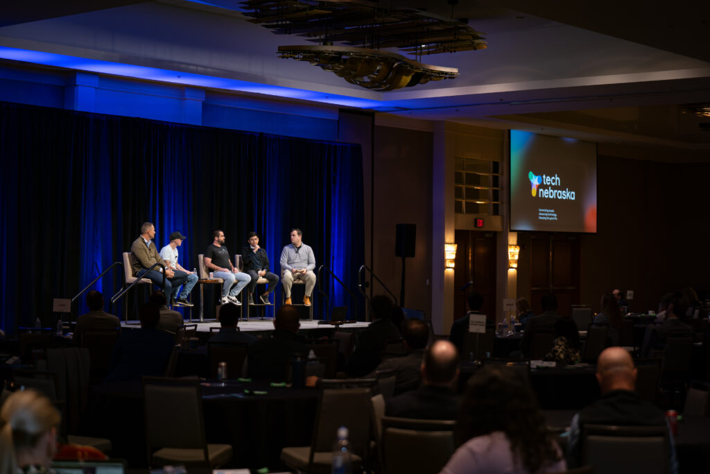 A group of men on stage at the Tech Nebraska Summit